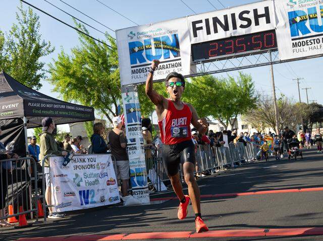 Lupe Palalia crosses the finish line to win the marathon with a time of 2:35.49.